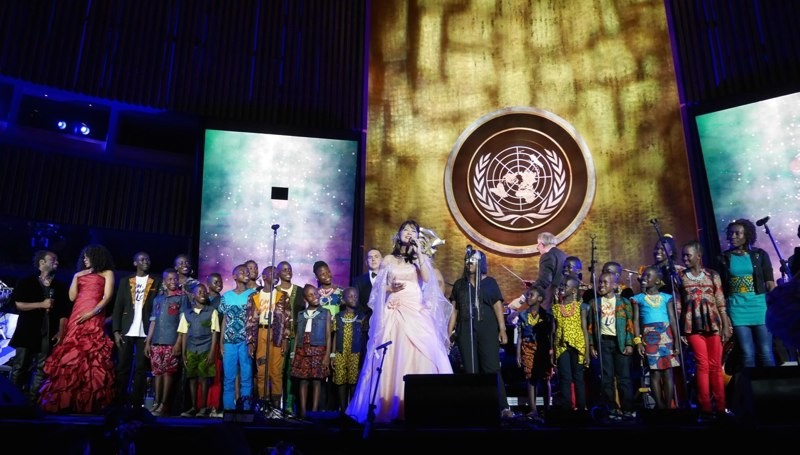 Soprano Seiko Lee with the NYC Symphony, the Watoto Choir (Uganda) and other featured soloist sing the finale song, “One World of Peace”